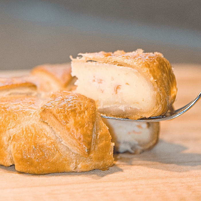 A delicious King Crab and Brie Pastry, golden brown and freshly baked.
Layers of French Brie cheese and Alaska King Crab meat