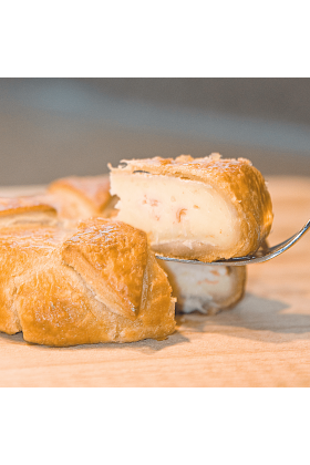 A delicious King Crab and Brie Pastry, golden brown and freshly baked.
Layers of French Brie cheese and Alaska King Crab meat