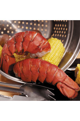 A premium Surf & Turf package containing 4 lobster tails and 4 fillet mignon steaks.